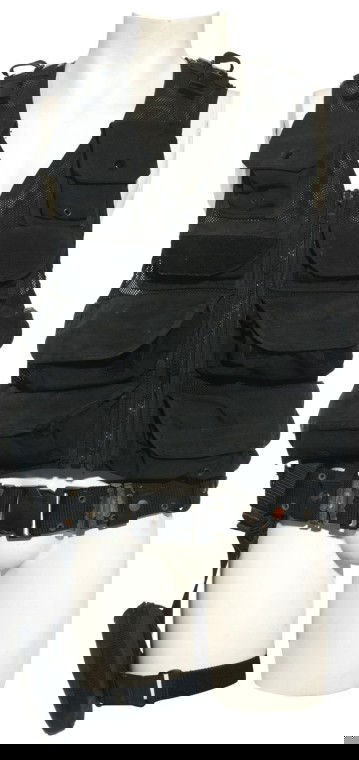 Teal'c's Tactical Vest with Wound from "The Ark of: Production Description: Tactical vest with wound from an Ori staff blast, worn by actor Christopher Judge as "Teal'c" in "Stargate: The Ark of Truth". The former First Prime of Apophis, Teal'c gave up