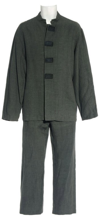 Beckett's Prison Costume from "The Kindred, Part 1: Production Description: Gray prison suit worn by actor Paul McGillion as "Carson Beckett" when Sheppard's unit finds their dead comrade alive in a cell. Beckett was a cast regular in Seasons Two and T