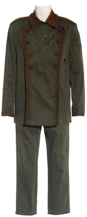 Genii Dead Soldier Uniform from "Harmony": Production Description: Bullet-ridden costume worn by a dead Genii soldier in the Stargate Atlantis Season Four episode, "Harmony". The Genii were meant to be an unpredictable "wild card" race in the 
