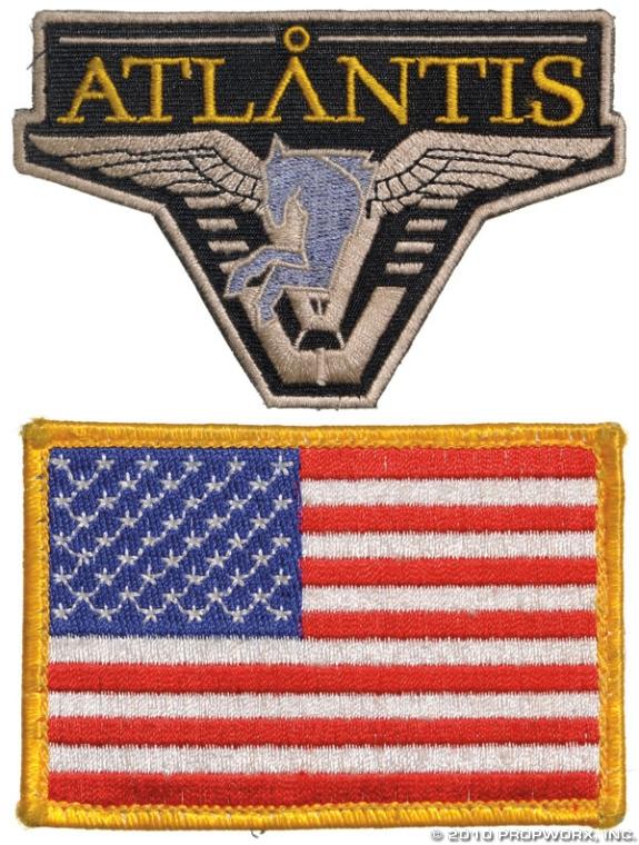 Vega's Patches: Production Description: A set of screen-used Atlantis and US flag patches from the uniform of actress Leela Savasta as "Alicia Vega", seen in the Stargate Atlantis Season Five episode "Whispers". Vega