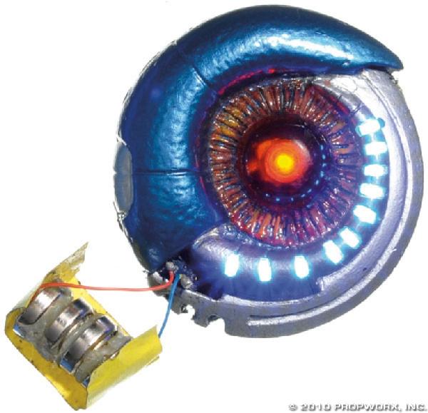 Mimic Device - Hero: Production Description: Mimic device worn by a duplicated officer at Stargate Command, seen in the Stargate SG-1 Season Three episode "Foothold." When mysterious aliens break into Stargate Command the