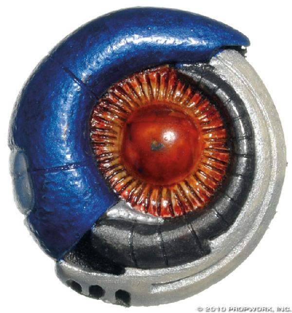 Mimic Device: Production Description: Mimic device worn by a duplicated officer at Stargate Command, seen in the Stargate SG-1 Season Three episode "Foothold." When mysterious aliens break into Stargate Command the
