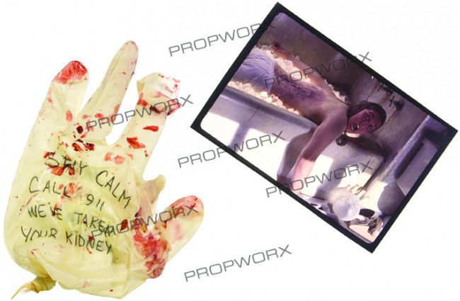 Jay's Kidney Glove: Production Description: Latex glove with "STAY CALM CALL 911 WE'VE TAKEN YOUR KIDNEY" written on the front and back in black ink from "Jay and Silent Bob Strike Back." This glove was next to the tub f