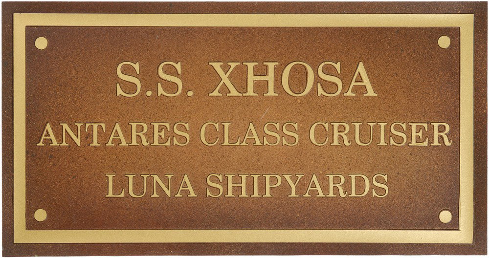 Star Trek: Deep Space Nine S.S. Xhosa Wall Plaque: Production Description: SS Xhosa dedication plaque used during the production of Star Trek: Deep Space Nine. This plaque was seen aboard the bridge of the S.S. Xhosa, Kasidy Yates' freighter, in numer