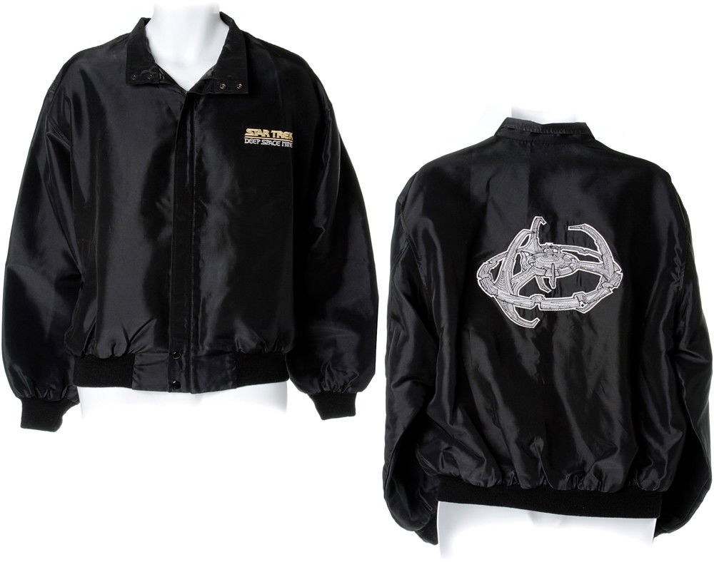 Star Trek: Deep Space Nine Crew Jacket: Production Description: Black embroidered jacket given as gifts to the crew of Star Trek: Deep Space Nine. From the collection of Mike and Denise Okuda. Technical Description: Constructed of Nylon a