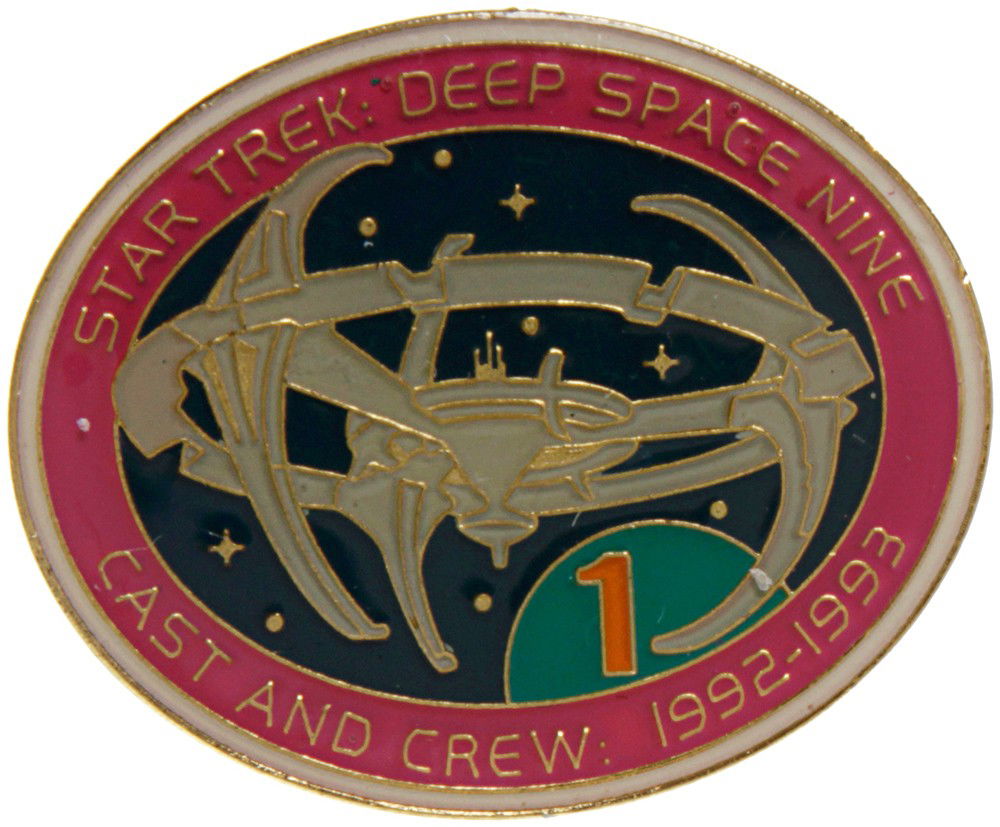 Star Trek Deep Space Nine Crew Pin: Production Description: Lapel pin given out to the cast and crew of Star Trek: Deep Space Nine Featuring the Cardassian space station Terok'Nor, as it was called during the occupation. Technical Desc