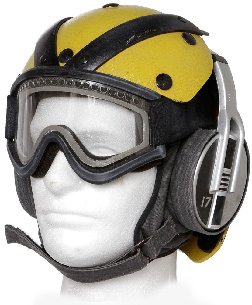 Battlestar Galactica Yellow Flight Crew Helmet: Production Description: Yellow flight-deck helmet worn by the signaling crew or "Lemon Heads," as affectionately called by the flight crew. Signalers provided visual cues to pilots in guiding craft m