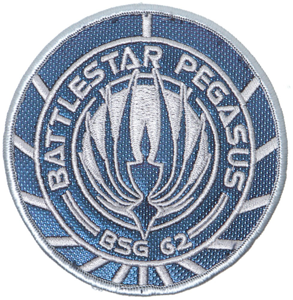 Battlestar Galactica Pegasus Patch - Version 2: Production Description: Standard blue and silver patch used on Battlestar Pegasus crew uniforms. Two styles of this patch were made during the shows run. The first was the same color as the standard G