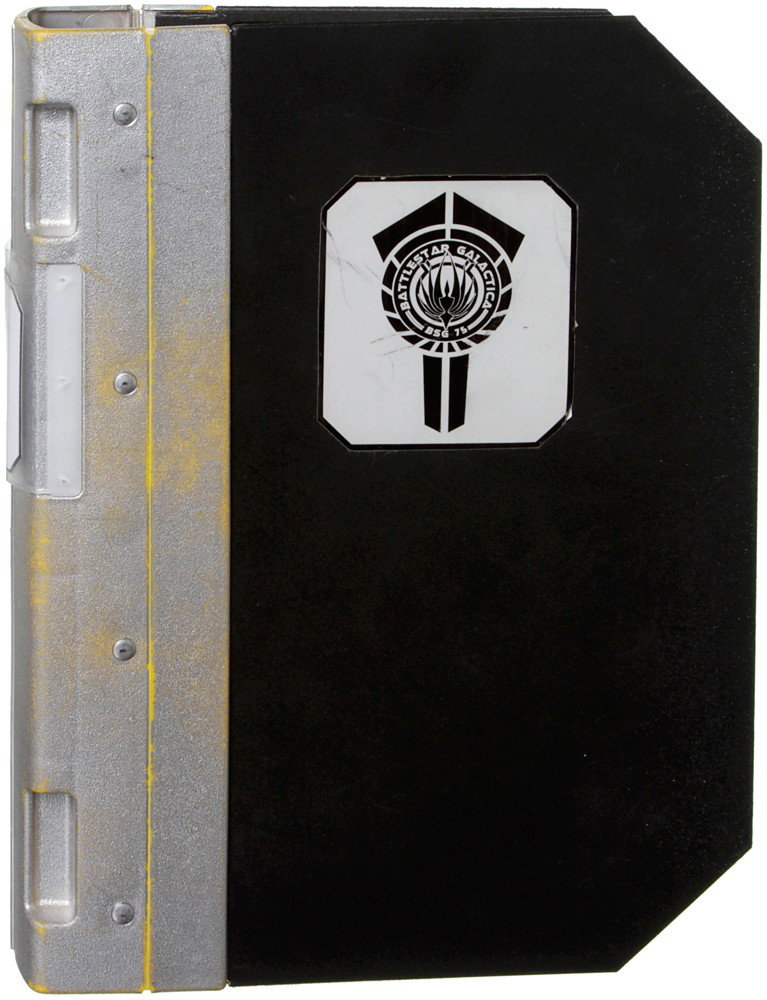 Battlestar Galactica Silver Binder: Production Description: Silver Battlestar Galactica Binder. Binder features various checklists inside. Binders such as these can be seen being carried around by members of the Galactica Crew. This ite
