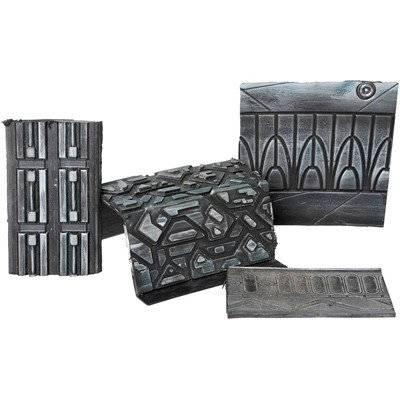 Pegasus Stargate Pieces: Production Description: Pieces of the Pegasus Galaxy Stargate created for Stargate Atlantis. These sections are pieces that were cut off by production during the assembly of the Stargate displays feat