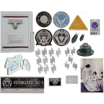 Ultimate Stargate Prop Collection: Production Description: Large collection of props from Stargate SG-1 and Stargate Atlantis. Collection includes: Atlantis file folder, production crew parking pass, Langford funeral pamphlet, SG-1 pat