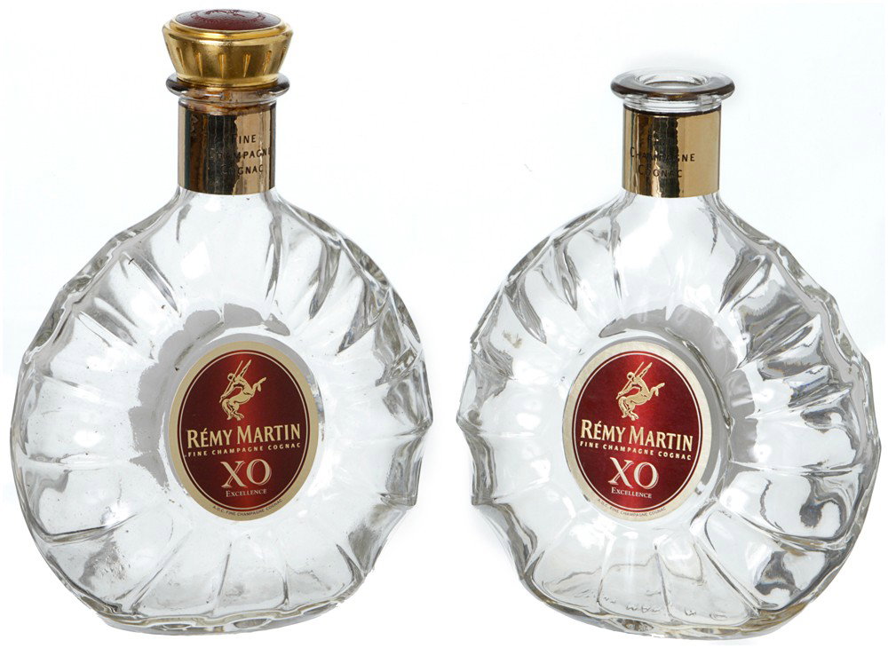 Iron Man 2 Tony Stark's Hero Remy Martin Bottles: Production Description: Tony Stark can be seen holding these bottles while he is intoxicated at his birthday party. Set includes one hero bottle with missing cap and one backup bottle with cap. Produc