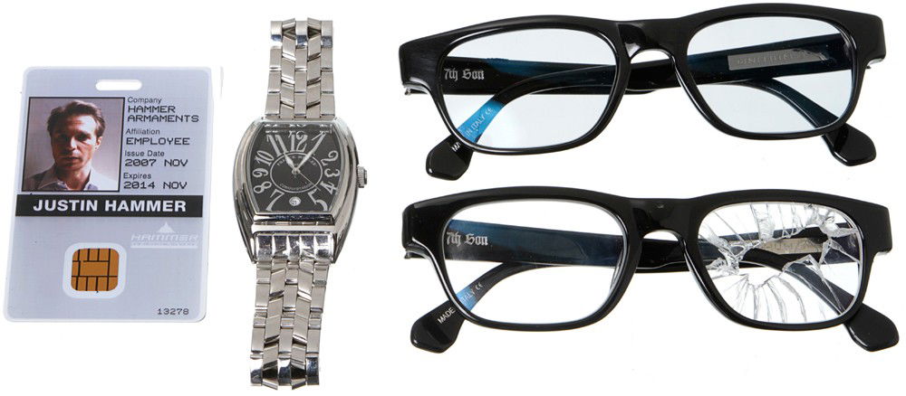 Iron Man 2 Justin Hammer Backup Personal Items: Production Description: Set of two black glasses with a light tint by FRANCK MULLER, one personal Hammer Industries ID card and silver square faced watch. These items were worn by Justin Hammer's sta