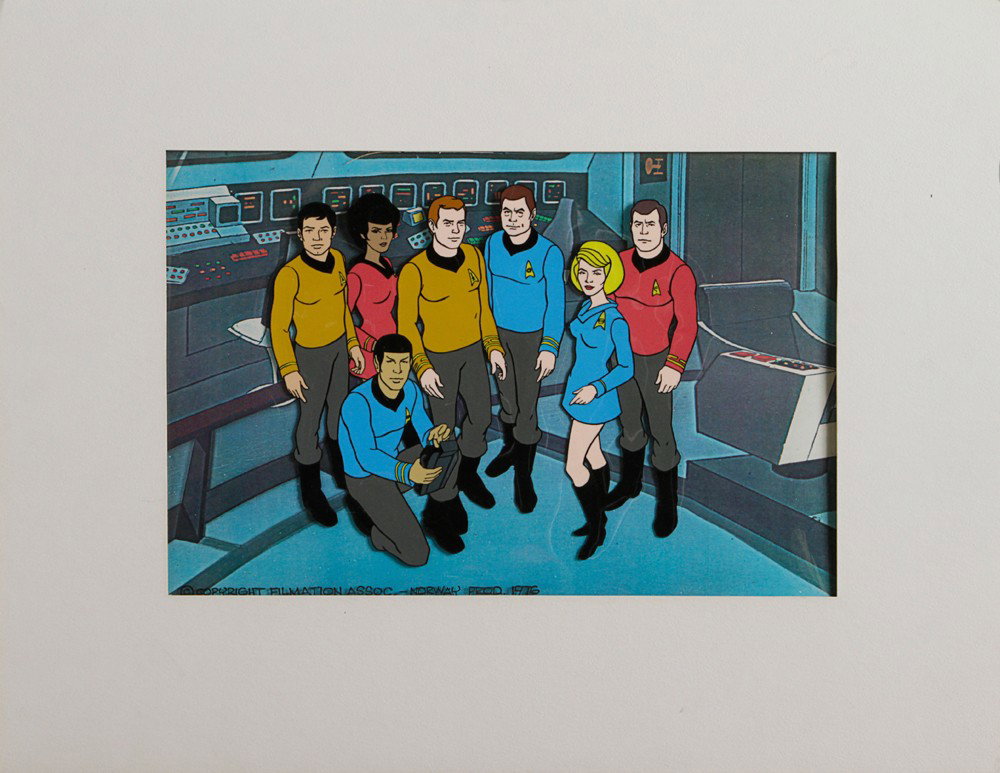Star Trek: The Animated Series Film Cell: Production Description: Film cell featuring a matte background of the Enterprise bridge, and a clear sheet of plastic with the images of the Enterprise crew. This cell was used by the team producing t