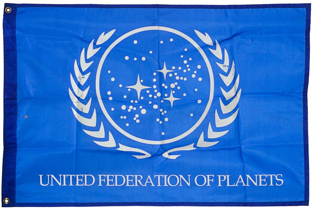 Star Trek: Deep Space Nine United Federation of Planets: A United Federation of Planets flag used as set decoration in Star Trek: Deep Space Nine. The Flag of the United Federation of Planets was a patriotic banner that consisted of a blue background with a