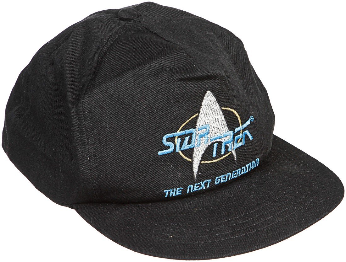 Star Trek: The Next Generation Cast & Crew Hat: A cast and crew hat given out by the production of Star Trek: The Next Generation. These rare items were never released to the public, only to those who worked on the show. This item is dark blue in c
