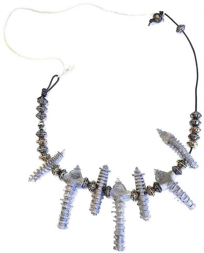 Star Trek: Deep Space Nine Klingon Bone Necklace: Ornate "Bone" necklace worn by "Leskit", the helmsman who served aboard “General Martok's” (J.G. Hertzler) ship, the "I.K.S. Rotarran" in the Star Trek: Deep Space Nine episode "Soldiers of the Em