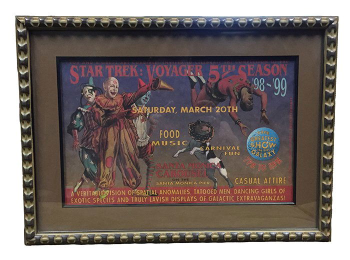 Star Trek: Voyager Cast & crew Framed 5th Season Poster: A rare fifth season cast & crew poster from Star Trek: Voyager. This piece was given out to the cast & crew as an invitation to the wrap party held on the Santa Monica Pier. Done in the style of a vin