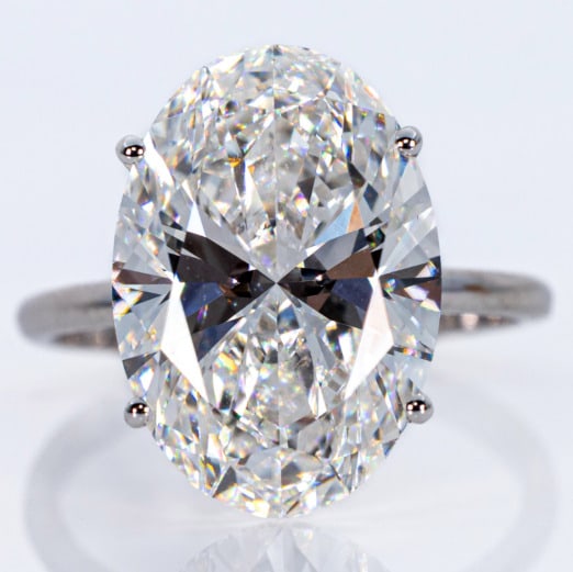6 Carat Oval Lab Grown Diamond Engagement Ring 14k White Gold IGI Certified: 6 Carat Oval Lab Grown Diamond Engagement Ring 14k White Gold IGI Certified. 6 Carat CT VS clarity brilliant oval lab grown diamond engagement ring set in 14k white gold. This fine piece of jewelry wa