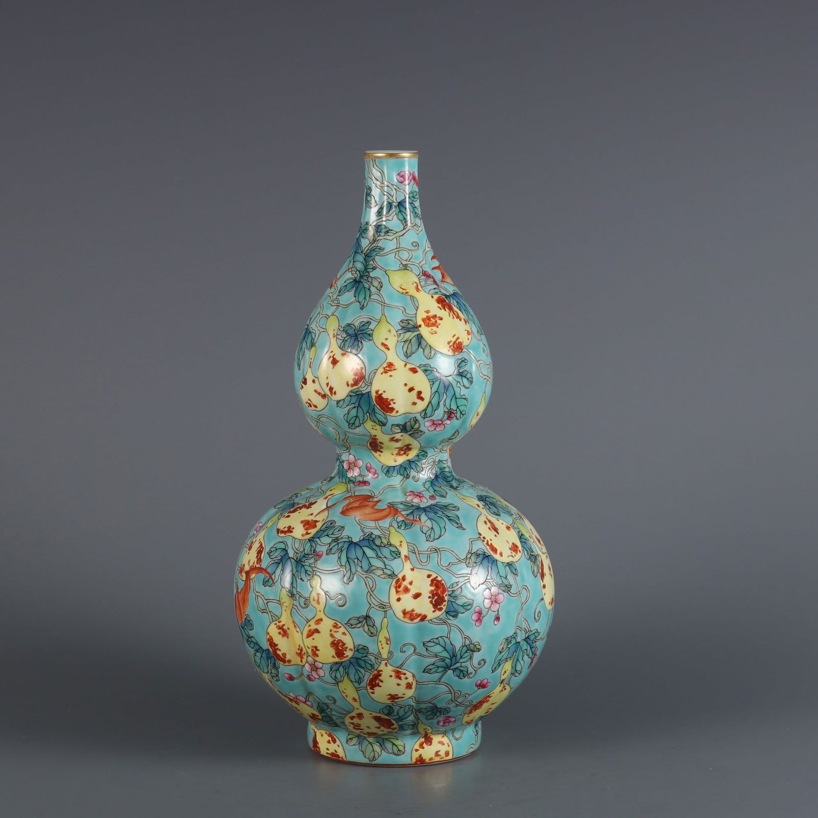 An Exquisite Turquoise Ground Famille-Rose Painted Gold Bats and Gourd Pattern Gourd-Shaped Vase (1 of 8)