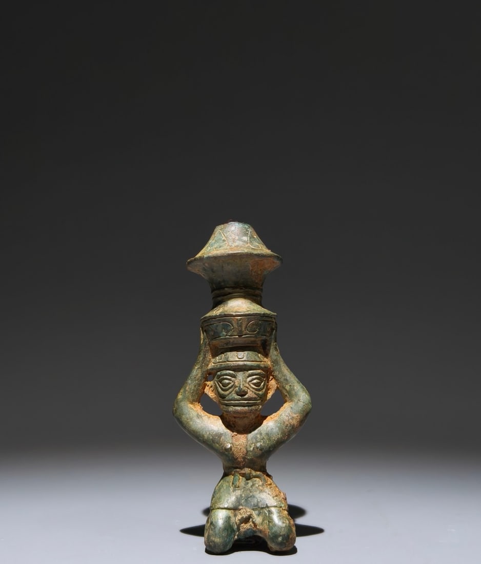 An Archaic Bronze Figure-Shaped Candlestick: An Archaic Bronze Figure-Shaped Candlestick,Shang Dynasty, China,Size:5.9inx2.6inx2in 青铜人物形烛台,中国商代