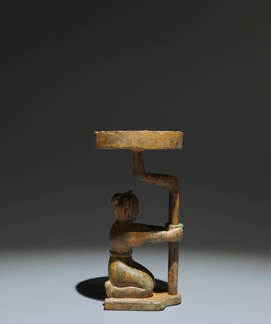 An Archaic Bronze Figure-Shaped Candlestick: An Archaic Bronze Figure-Shaped Candlestick,Han Dynasty, China,Size:6.5inx3.3inx2.4in 青铜人物形烛台,中国汉代