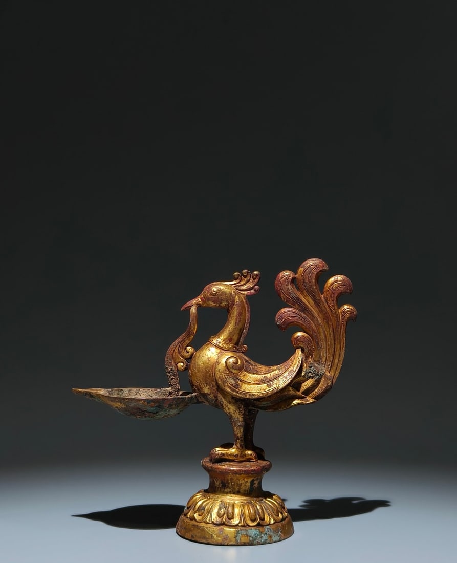 An Exquisite Gilt Bronze Phoenix-Shaped Candlestick: An Exquisite Gilt Bronze Phoenix-Shaped Candlestick,The Two Jin Dynasties of China,Size:8.1inx8.3inx3.3in 铜鎏金凤形烛台,中国两晋ą