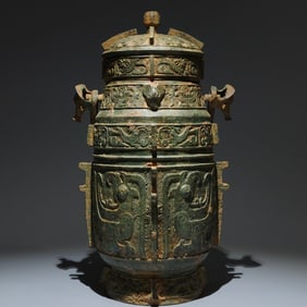 An Archaic Bronze Phoenix Pattern Loop-handled Pot