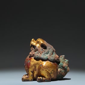 A Rare Gilt Bronze Lion Ornament