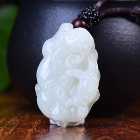 An Exquisite White Jade Wealth-Attracting Creature Pendant