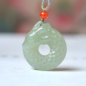 An Exquisite White Jade Dragon Pendant