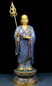 A solemn cloisonné statue of Xuanzang