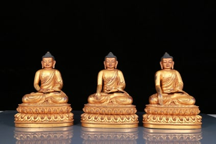 Three Brilliant Gilt-Bronze Figures Of Buddha