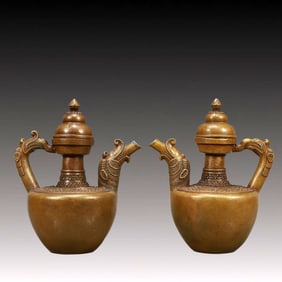 A Pair of Rare Bronze Ewers