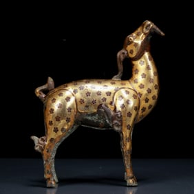 A Rare Bronze Inlaid Gold and Silver Goat Ornament