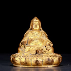 An exquisite gilt bronze statue of the Guru