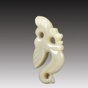 A Rare White Jade Auspicious Beast Pendant
