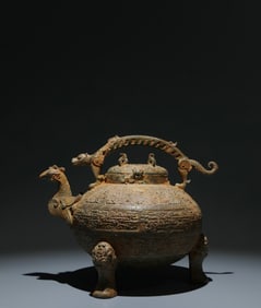 An Archaic Bronze Tripod Phoenix-head Food Vessel