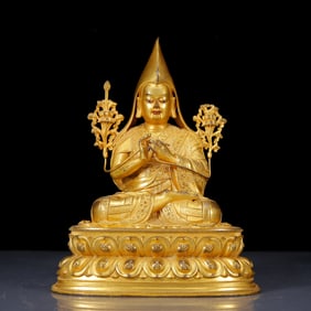 A Solemn Gilt Bronze Statue of Guru