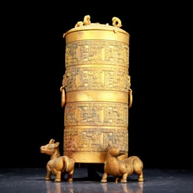 An exquisite gilt bronze tripod jar with auspicious animal patterns