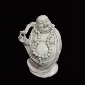 A Solemn Blance-De-Chine Statue of Maitreya Buddha