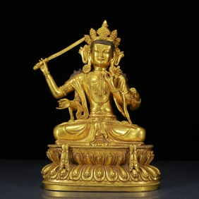 A Solemn Gilt Bronze Statue of Four-Armed Manjusri