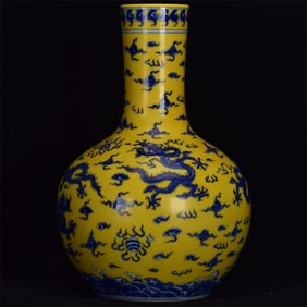 A Rare Yellow Glazed Blue and White Auspicious Cloud and Dragon Pattern Vase