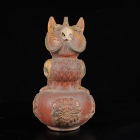 An Exquisite Tang Tri-Color Glazed Pottery Animal Gourd-Shaped Ornament