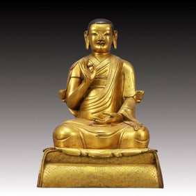 A Solemn Gilt Bronze Statue of Guru
