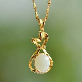 An Exquisite Sterling Silver-Gold Plated Inlaid White Jade Pendant