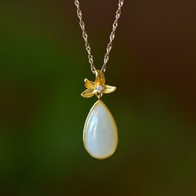An Exquisite Sterling Silver-Gold Plated Inlaid White Jade Pendant