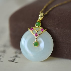 An Exquisite Sterling Silver-Gold Plated Inlaid White Jade Pendant