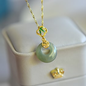 An Exquisite Sterling Silver-Gold Plated Inlaid White Jade Pendant