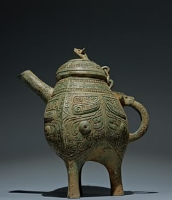An Archaic Bronze Beast-Face Pattern Tripod Pot